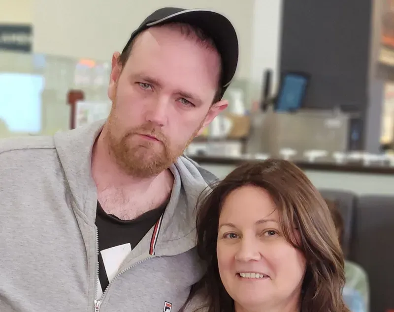 A participant with his aunty, catching up together at a café