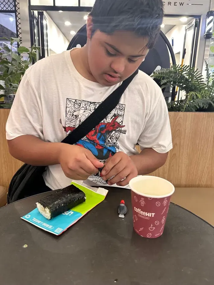 A participant enjoying a sushi lunch out in the community